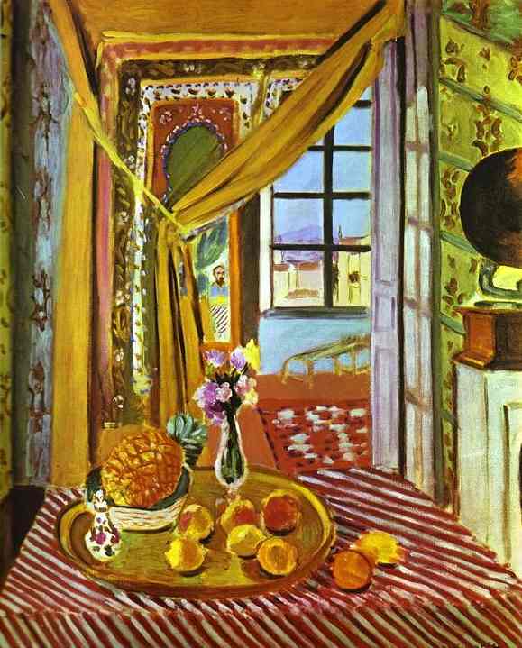 A sunlit room with a red-and-white striped table holds a brass tray of fruit and a small vase of flowers; golden curtains frame a doorway leading to a tiled room and a black-gridded window with distant hills; at right a dark phonograph horn sits on a cabinet against patterned wallpaper, uniting the interior in warm, rhythmic color.