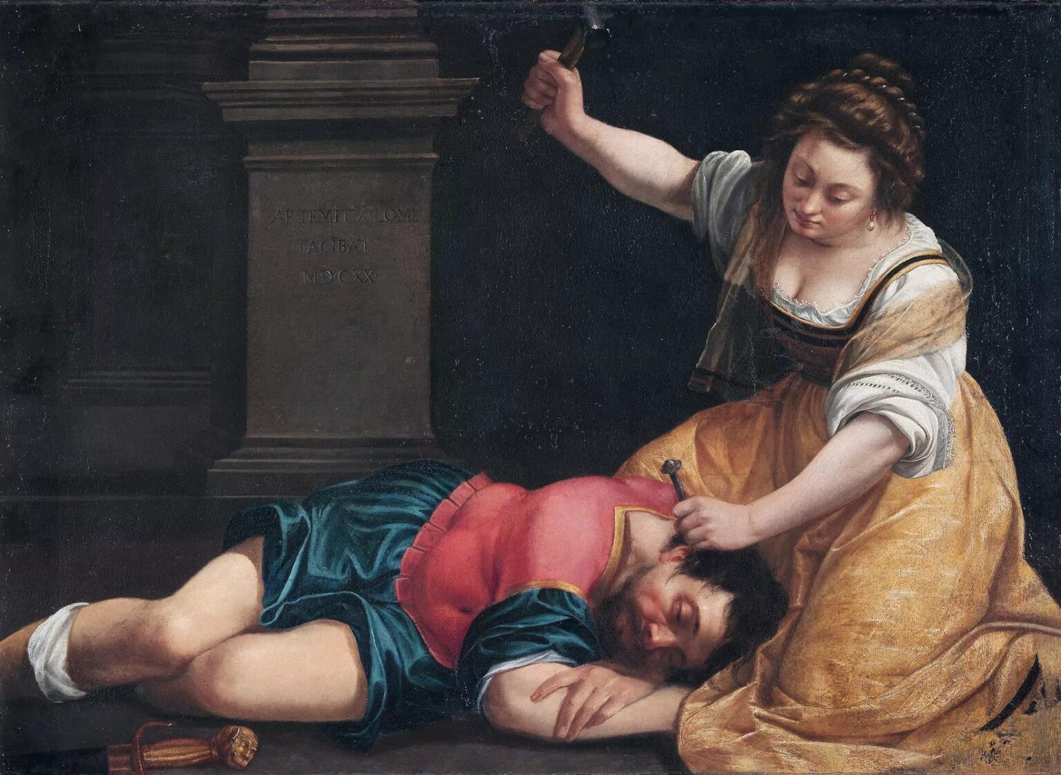 Jael kneels beside the sleeping Sisera, gripping a tent peg to his temple and raising a hammer, while the disarmed general lies diagonally across the foreground; strong light illuminates Jael’s gold dress against a dark backdrop with a stone pedestal bearing Artemisia’s signature.
