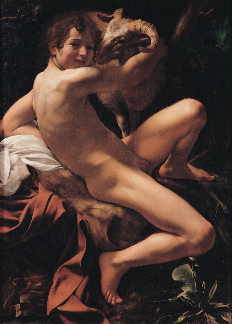 A smiling adolescent John the Baptist reclines nude on a pelt, twisting toward the viewer while embracing a ram; raking light models his body and the animal’s horn against a dark, shallow background with a red cloak pooling below.