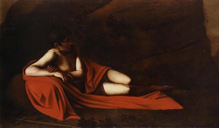 A half-nude youth identified as John the Baptist reclines on the ground, wrapped in a vivid red mantle with a slender reed cross beside him; warm light models his skin against a dark rocky background, capturing a quiet pause before his prophetic mission.
