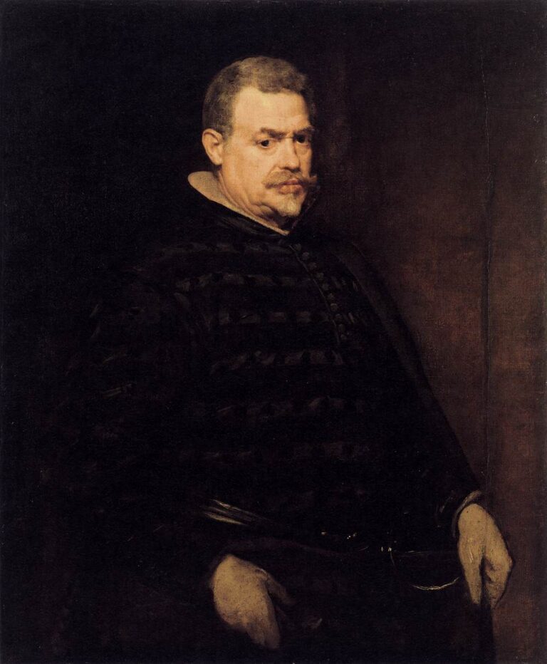 Three-quarter portrait of Juan Mateos in dark court livery, his face and hands illuminated against a deep brown-black background; he stands squarely with alert eyes and restrained expression, conveying the calm authority of the royal huntsman.