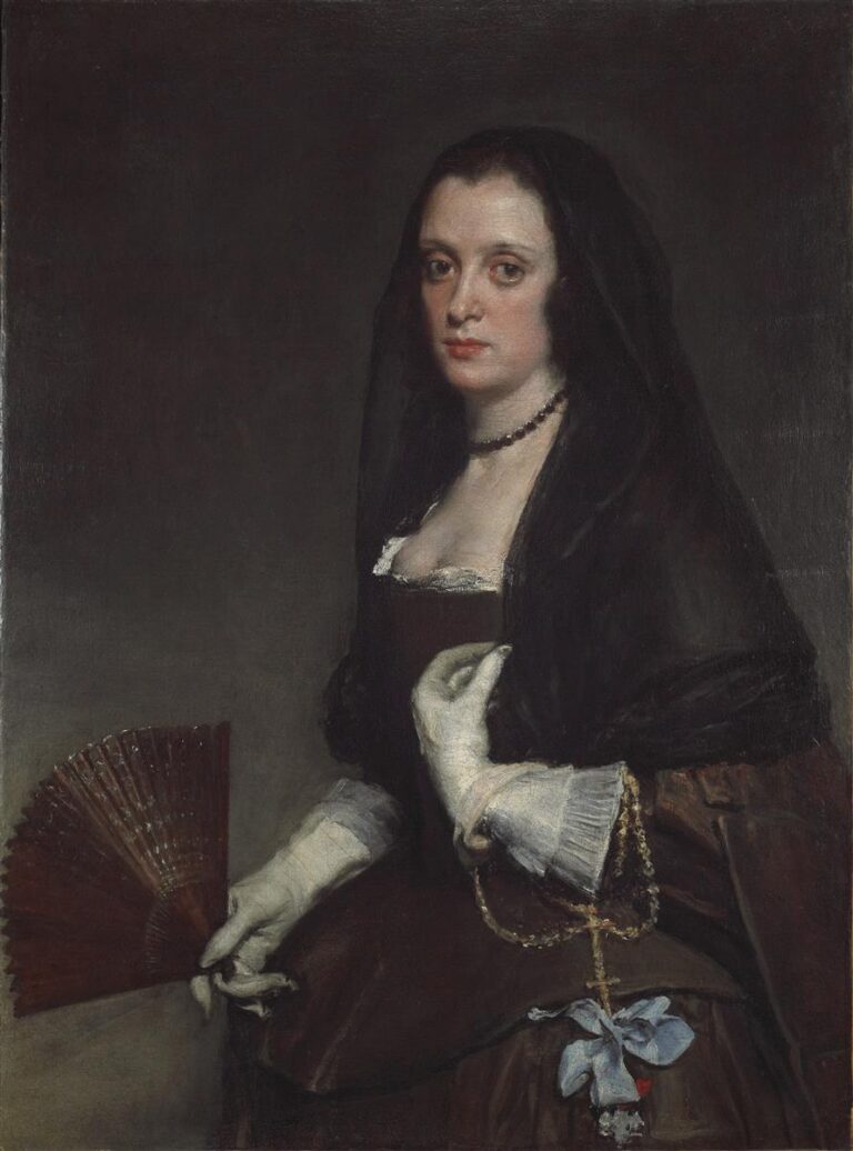 Half-length portrait of a woman in a black mantilla and dark dress, wearing white gloves and holding an open fan, a rosary with blue bow at her waist, set against a soft dark background with a calm, direct gaze.