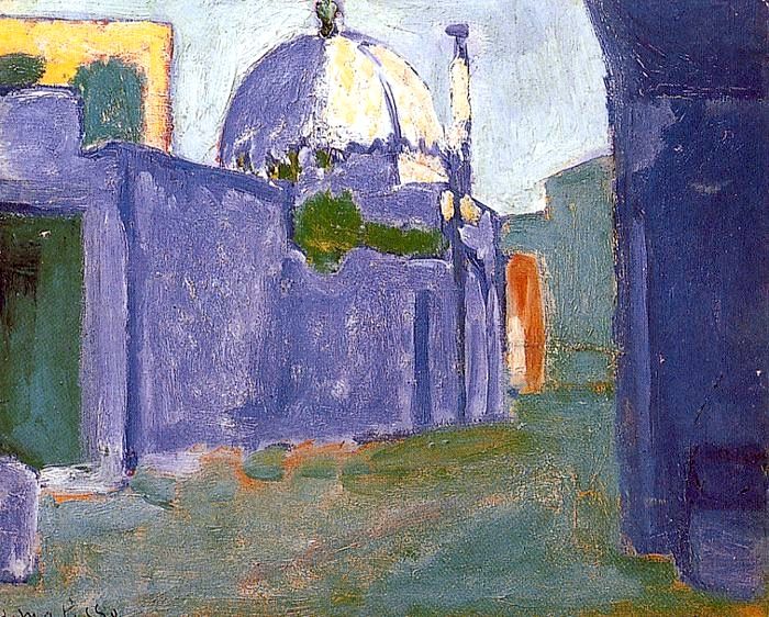 Sunlit Moroccan street painted in broad violet-blue planes leading to a white domed shrine; a small orange doorway glows in the distance; patches of green vegetation and a pale sky heighten the calm, with minimal detail and visible brushwork in Henri Matisse’s 1912 “Le Marabout.”