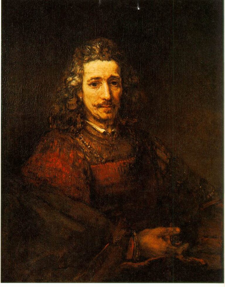 Three-quarter portrait of a long-haired man in warm red-brown clothing, softly lit against a dark background, holding a small magnifying glass in his right hand while his calm gaze meets the viewer.