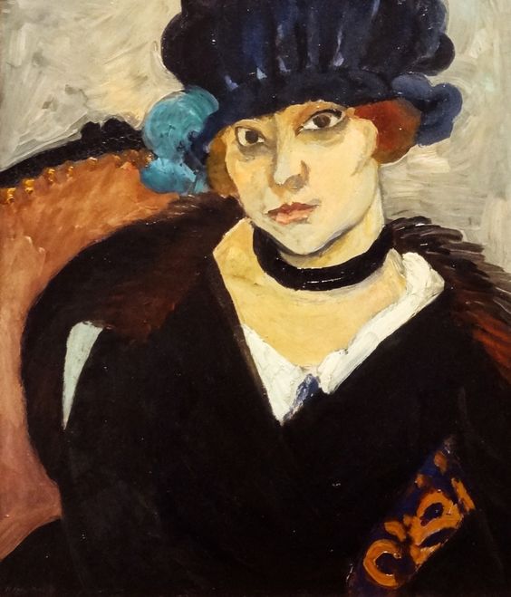 Half-length portrait by Henri Matisse of Marguerite wearing a deep blue leather hat and black choker, seated before a gray ground with a warm peach chair and a small orange-blue patterned patch; simplified planes, bold black contours, and tuned color contrasts emphasize a modern, intimate presence.