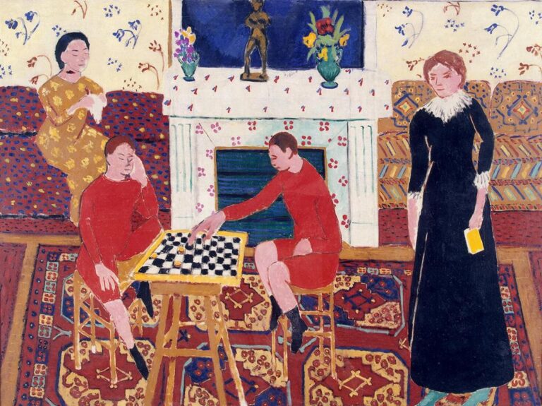 Interior with richly patterned rugs, sofa, and sprigged wallpaper; two youths in red tunics play a game on a black-and-white board at center; a seated woman in a yellow dress is at left, a woman in a long black dress holding a book stands at right; white mantel with small bronze and vases, blue fireplace opening and panel above, all rendered in bold, flat colors in Henri Matisse’s 1911 “Painter’s Family.”