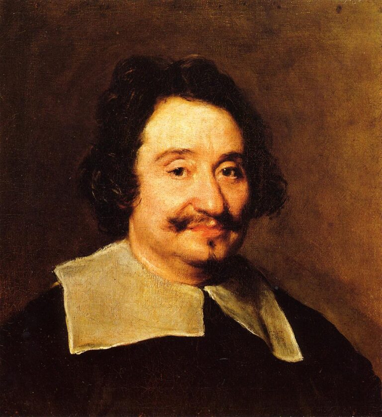 Bust-length portrait of a middle-aged man with dark hair and a neat moustache, smiling gently and wearing a black garment with a sharp white collar, set against a warm brown atmospheric background.