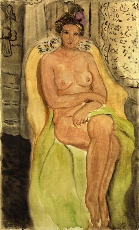 A seated nude woman with legs crossed rests in a yellow armchair within a pale interior; a green drape falls over her thighs, a patterned curtain appears at right, and soft light models her figure with gentle contours, painted by Henri Matisse in 1920.