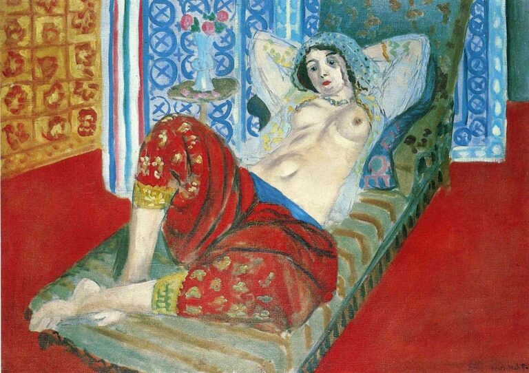 Reclining odalisque on a striped divan wearing embroidered red culottes, bare torso, beaded headscarf; behind her a blue patterned screen and striped drapery, with a red floor and gold wall textile, painted in Matisse’s luminous Nice-period style.