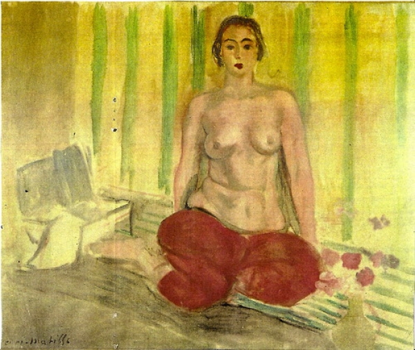 A frontal, kneeling woman with bare torso and voluminous red trousers poses on a striped mat before a yellow-green striped wall; a small table sits at left and a vase of pink flowers at right, painted by Henri Matisse in 1925.