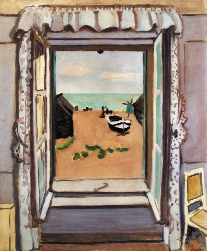 An interior view through open French windows with scalloped valance and patterned curtains onto a sandy beach at Étretat; a white boat rests on the shore between dark huts, small figures dot the distance, and a turquoise sea meets a pale sky, painted by Henri Matisse in 1920.