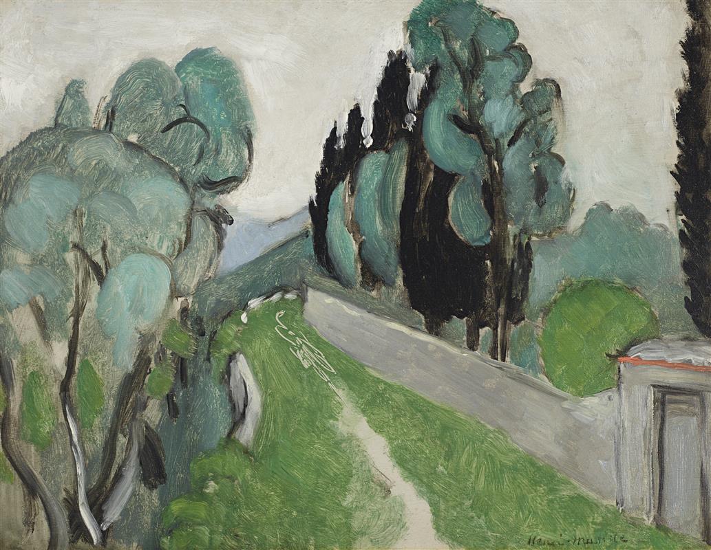 Hillside landscape by Henri Matisse (1918) with a gray road running diagonally across bright green grass; sea-glass olive trees and tall dark cypresses against a pale sky; small roofed structure at lower right; visible brushstrokes and restrained, luminous palette.