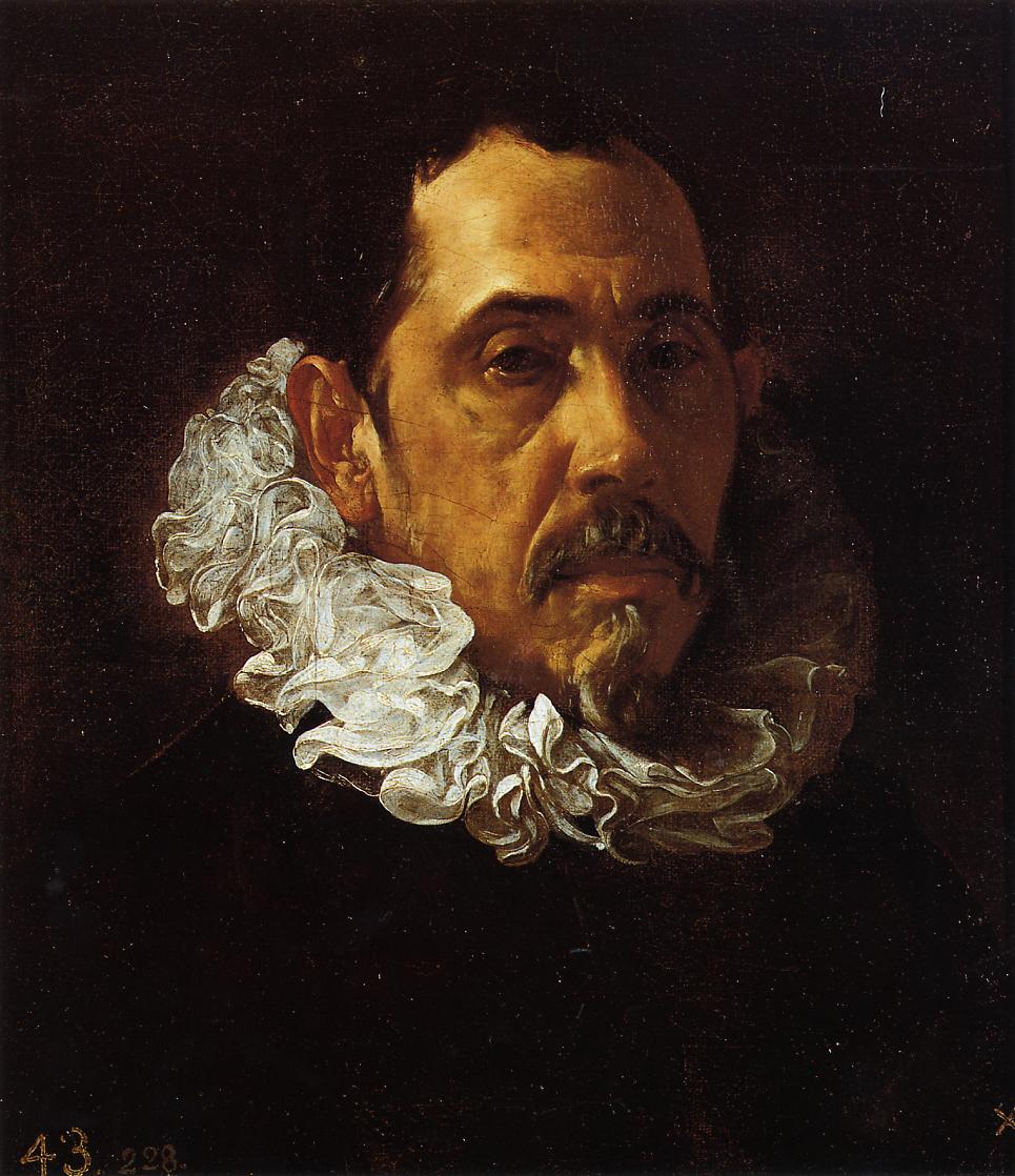 Close portrait of a gentleman in a black costume with a rippling white ruff, his head turned toward the light and a short goatee framing a tense mouth, set against a dark background in Velazquez’s 1622 painting.