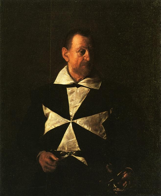 An older Knight of Malta in a black mantle with a white eight-pointed cross faces left in raking light, his hands resting near a belt and helmet while the background falls into deep shadow.