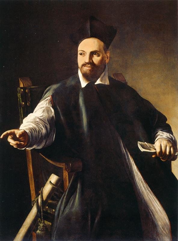 A seated cleric in a black mozzetta and biretta turns in a wooden chair, extending his right hand as if giving an order while holding a folded paper in his left; sharp light illuminates his face and white sleeves against a plain dark background.