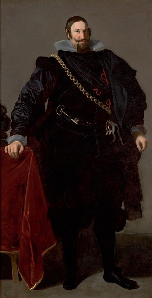 Full-length portrait of the Count-Duke of Olivares standing with one hand on a red-draped table, dressed in black satin with a high gray-white collar and diagonal gold chain, sword at his side, set against a quiet neutral background; painted by Diego Velazquez in 1624.