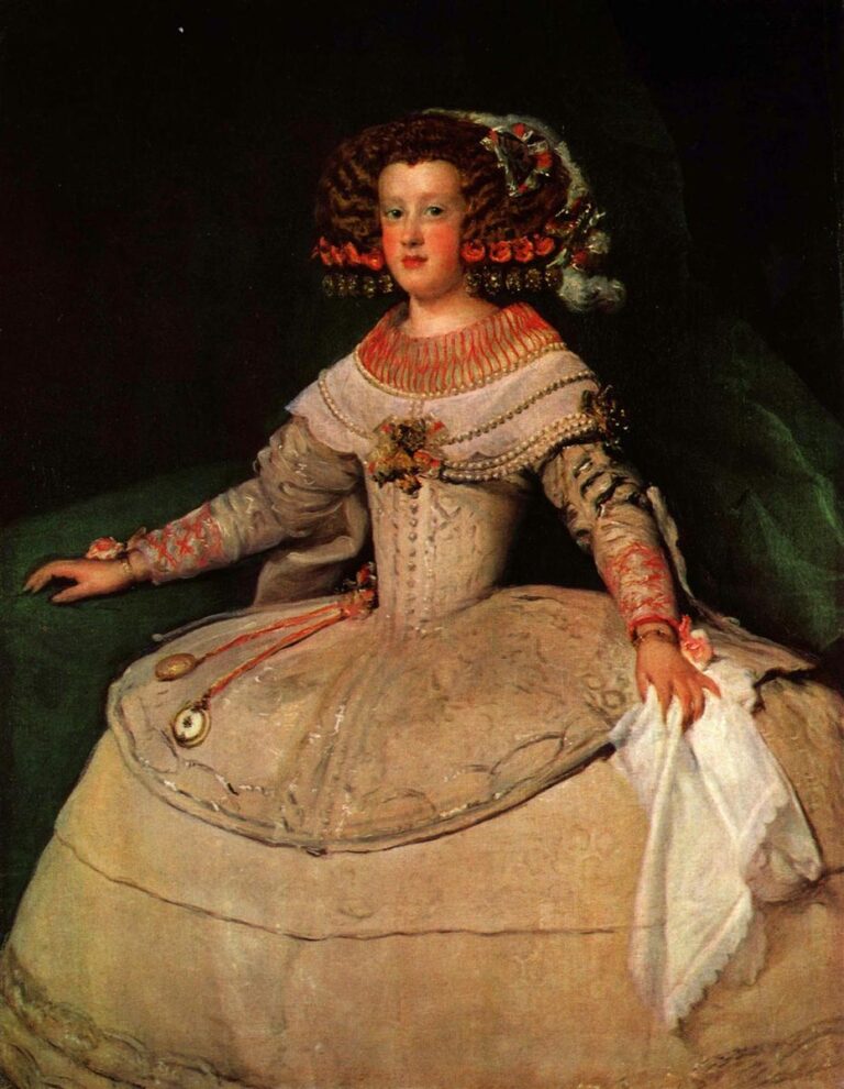 Young Infanta María Teresa seated in a pale, wide court dress with coral ornaments and jeweled coiffure, holding a white handkerchief, set against a dark green-toned background with a calm, frontal gaze.