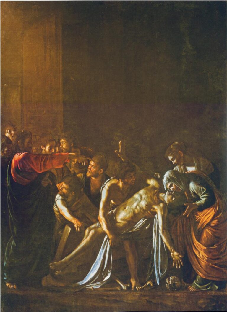 In a dark interior Christ extends his arm toward the pale body of Lazarus, whose torso arches as helpers lift him; mourners and disciples crowd around while a beam of light strikes the rising figure, with a skull on the floor near his outstretched hand.