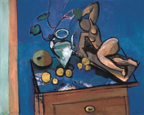 Still life on a diagonal tabletop with a turquoise glass jug of ivy, bright lemons, a green melon, and a reclining ocher sculptural figure on a small plinth; glossy reflections on the table, honey drawer front with brass pull, and a broad blue wall in the background; decisive black contours characteristic of Matisse in 1916.