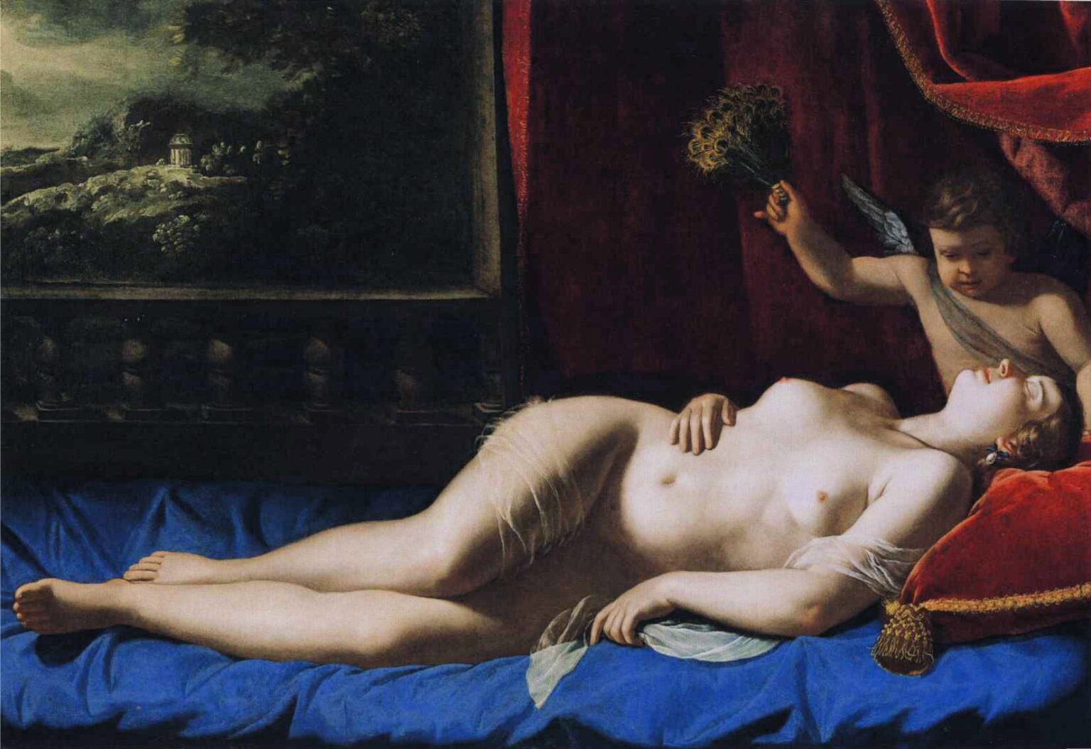 Venus sleeps nude on a blue bedspread under a crimson curtain, head on a red velvet pillow as a small winged Cupid cools her with a fan of peacock feathers; a framed landscape appears at the left, the room lit warmly across her reclining body.