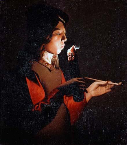 Candlelit profile of a young man lighting a pipe with a glowing slow-match; warm ember illuminates his cheeks, red sleeves, and hands against a dark background.