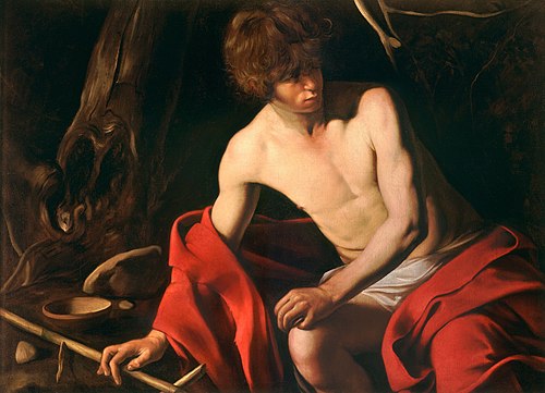A young John the Baptist sits in a dark wilderness, his bare torso lit as he turns away; a red cloak drapes across his lap, his hand rests near a reed cross, and a simple bowl and twisted tree complete the sparse setting.