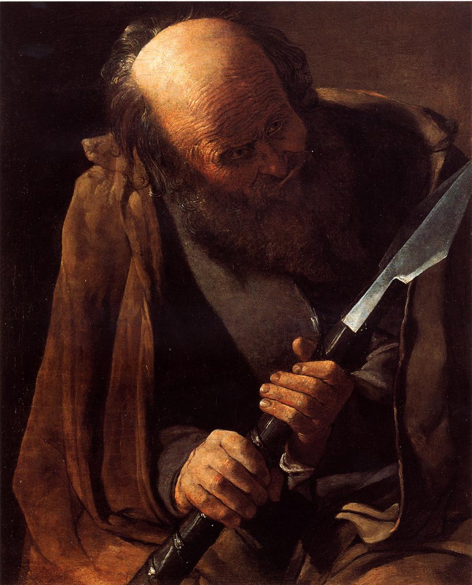 Half-length St. Thomas leans forward under warm light, bald crown and beard illuminated as his rough hands grip a black-shafted tool with a bright, chisel-like blade; a brown cloak drapes over a gray tunic against a simple two-tone wall.