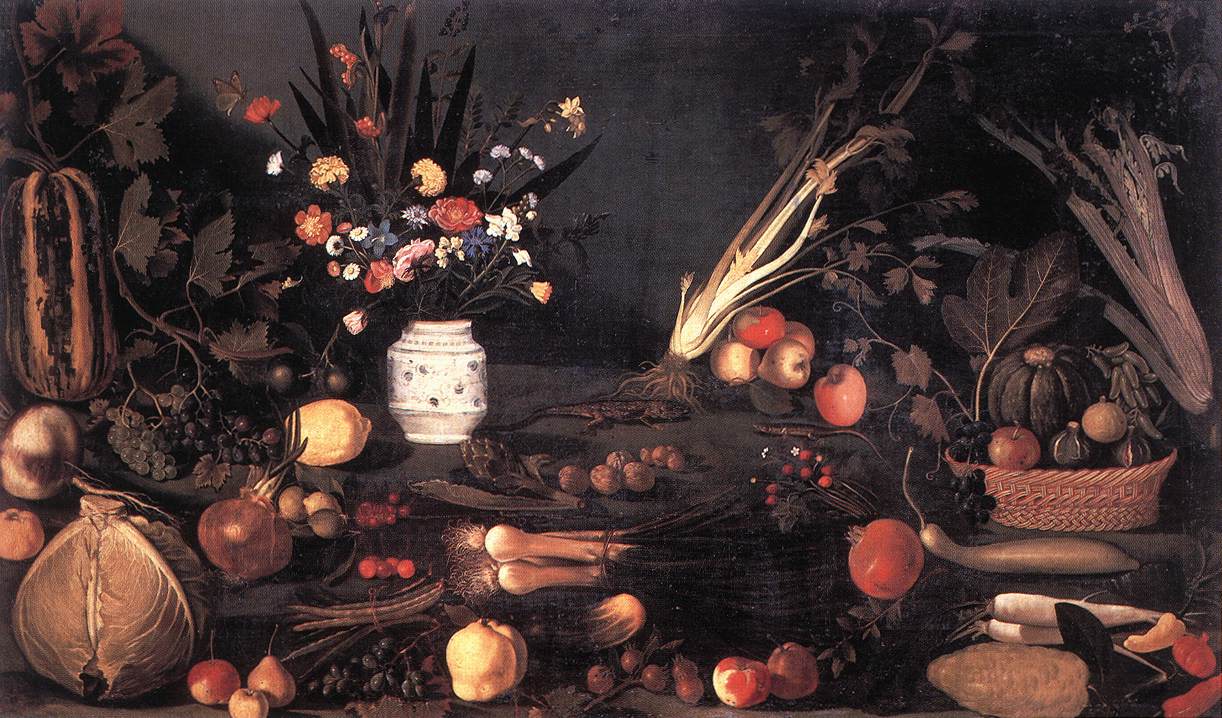 A dark tabletop overflows with a central bouquet in a ceramic vase, flanked by celery, squash, grapes, figs, and a wicker basket of fruit; scattered onions, nuts, radishes, and quinces catch raking light against a deep shadowed background.