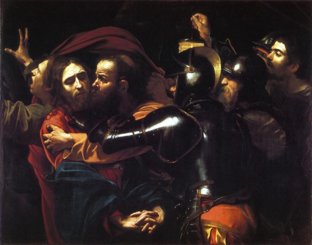 In a dark, crowded scene Judas kisses Christ while armored soldiers seize him; a lantern shines on Christ’s calm face, glossy armor, and the anguished apostle John as bodies press tightly across a shallow stage.