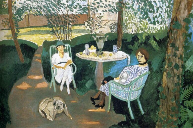 Garden scene with two women seated in pale-green chairs around an oval stone table set with a silver urn, glass, blue-and-white jug, and lemons; a dog lies on the path in the foreground; clipped hedges, slim trees, and a dappled leaf canopy frame a distant ocher lawn and wall, all painted with cool greens and soft light.