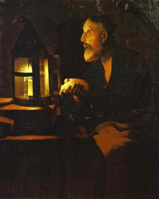 Candlelit scene of an elderly man—St. Peter—seated beside a lantern, hands clasped and face turned toward the warm glow, rendered in deep shadows and amber light within a dark interior.