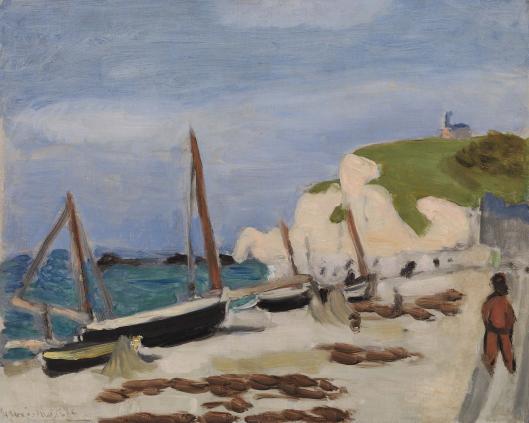 A seaside scene with a black fishing boat beached on sand, nets draped from leaning masts, turquoise water at left, white chalk cliffs topped with green grass and a small chapel in the distance, and a lone figure standing at the right under a pale blue sky.