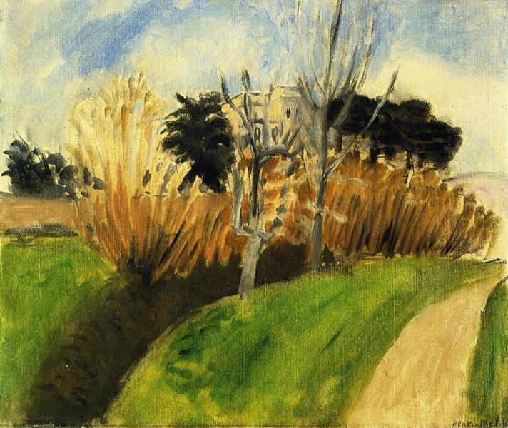 Landscape with a dark diagonal stream at lower left, bright green grassy slopes, ochre path curving up the right, tall tawny reeds and two pale leafless trees in the middle ground, dark pines behind, and a high blue-and-white sky; painted with broad strokes and warm–cool contrasts.