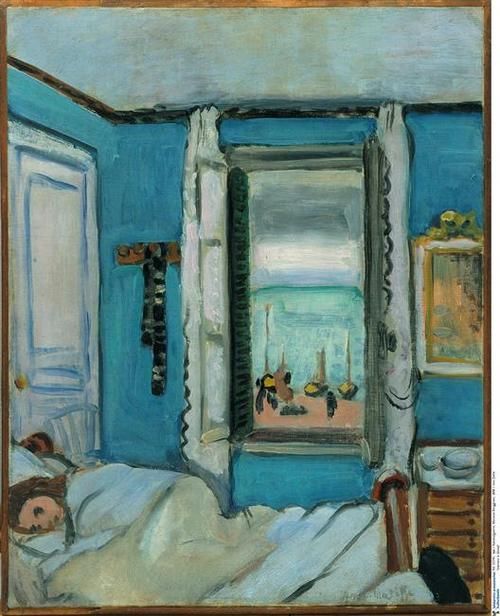 Blue-walled bedroom with a woman asleep in a white bed at lower left; at center a tall window with green shutters opens to bands of turquoise sea and pale sky, with small boats on the sill; a blue door at left, a gilt mirror and dresser at right, all under soft, even light.