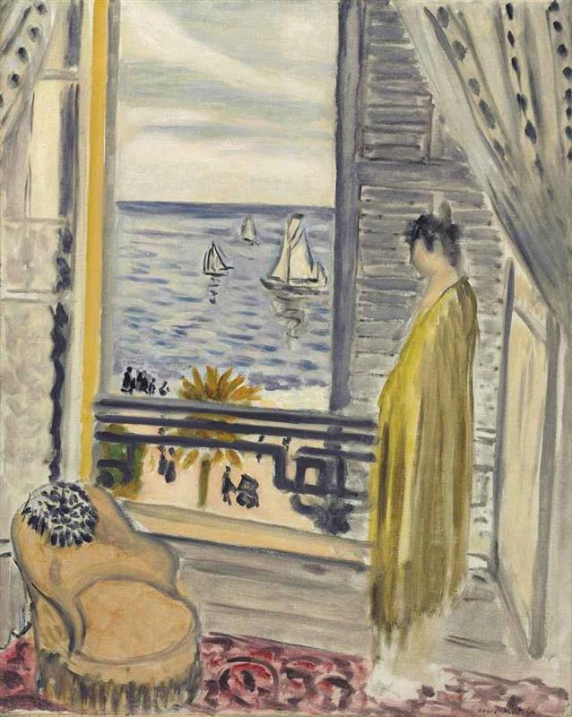 Interior with a woman in a pale yellow robe standing beside an open window; shutters and curtains frame a view of blue sea with sailboats, a balcony railing, an armchair, and a red patterned carpet, painted by Henri Matisse in 1920.