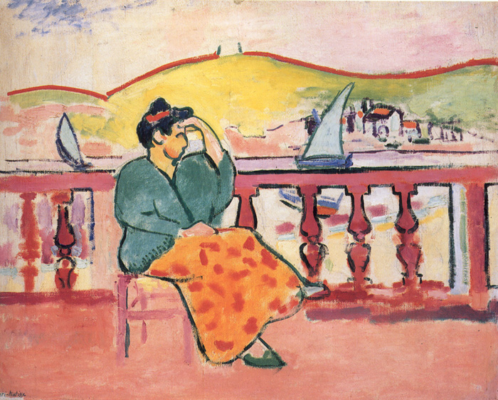 A seated woman on a coral-pink terrace gazes toward a bright harbor; she wears a green blouse and an orange skirt with red spots, framed by a red balustrade, yellow hills, and small white sailboats under a pale sky, painted with bold outlines and flat, vivid colors.