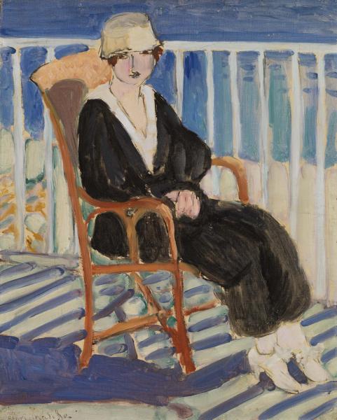 A young woman in a black dress and pale hat sits on a wicker chair on a balcony; white railings and blue sea behind her, strong diagonal blue shadows across the floor, with simplified forms, bold black accents, and a restrained Mediterranean palette.