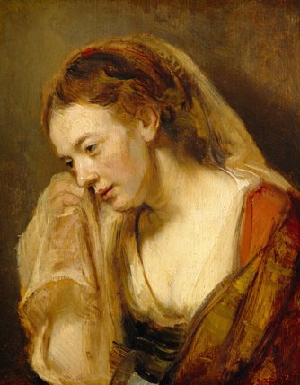 Close three-quarter view of a young woman tilting her head and pressing a translucent veil to her cheek; warm light grazes her face against a brown ground, with muted red and ochre clothing painted in Rembrandt’s soft, textured strokes.
