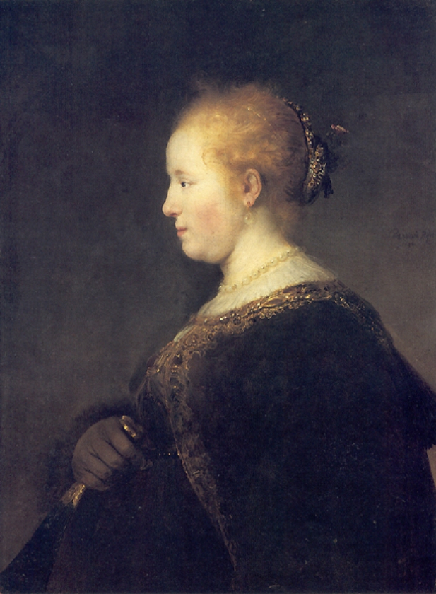 Rembrandt’s 1632 painting of a young woman shown in pure left profile, her face softly lit against a dark ground, wearing pearls and a jeweled hairband, holding a closed fan in a gloved hand while gold-trimmed dark fabric recedes into shadow.