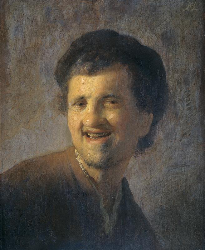 Half-length portrait of a young man turning left and laughing with mouth open; warm light glows on his cheeks and forehead, a dark cap frames his head, and a neutral gray background enhances Rembrandt’s lively brushwork and spontaneous expression.