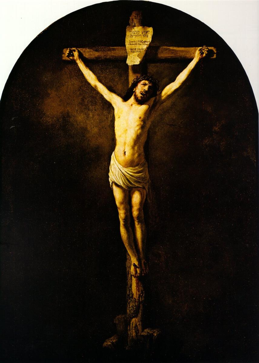 Painting of the crucifixion by Rembrandt showing Christ illuminated on a wooden cross against deep darkness, head bowed, arms outstretched, and a white loincloth glowing under a soft, golden light.