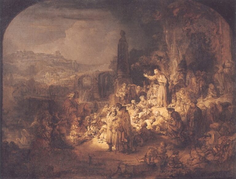 Large Rembrandt scene of John the Baptist speaking to a crowd on a wooded hillside, warm light illuminating groups of listeners as distant architecture fades into a hazy landscape.