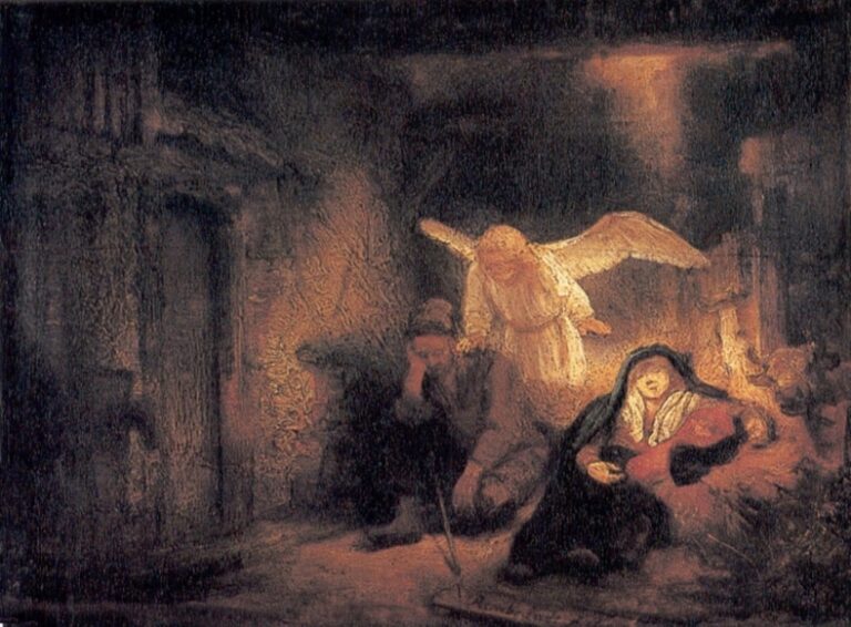 In a dim stable, Joseph sleeps while a softly glowing angel leans toward him; Mary cradles the infant beside a warm lamplight, rough walls and a dark doorway surrounding the scene in deep shadow.