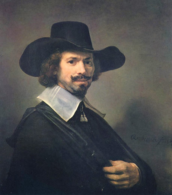 Half-length portrait of a bearded man in a wide-brimmed black hat and white collar, turning toward the viewer while lifting a hand to his cloak against a soft gray-brown background; Rembrandt’s signature appears to the right.