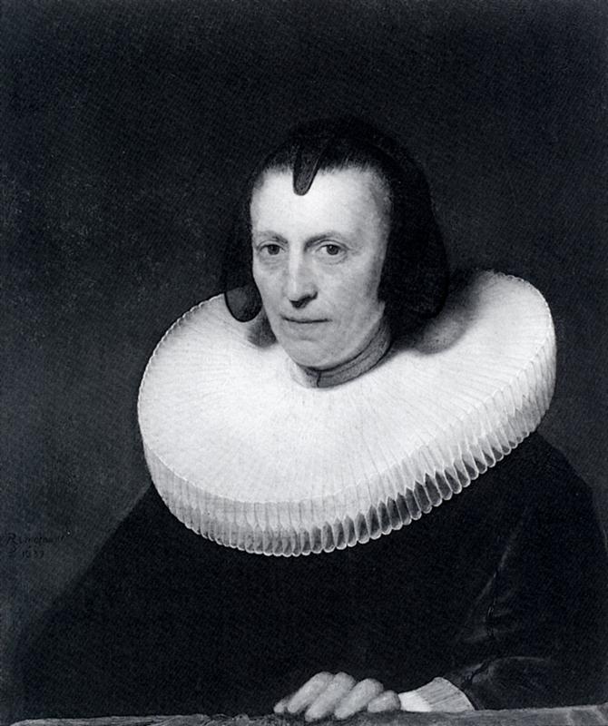 Half-length 1639 portrait by Rembrandt of Alijdt Adriaensdr facing forward against a dark background, wearing a large pleated millstone ruff and plain dark gown, with calm hands resting near a table and a thoughtful, dignified expression.