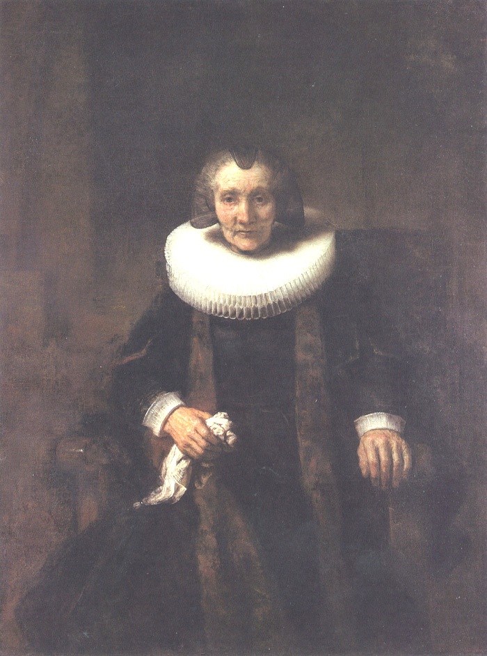 Late Rembrandt portrait of an elderly Dutch woman seated frontally in a high-backed chair, wearing a large white ruff and dark gown, one hand resting on the armrest and the other holding a white handkerchief, softly illuminated against a warm, dark background.