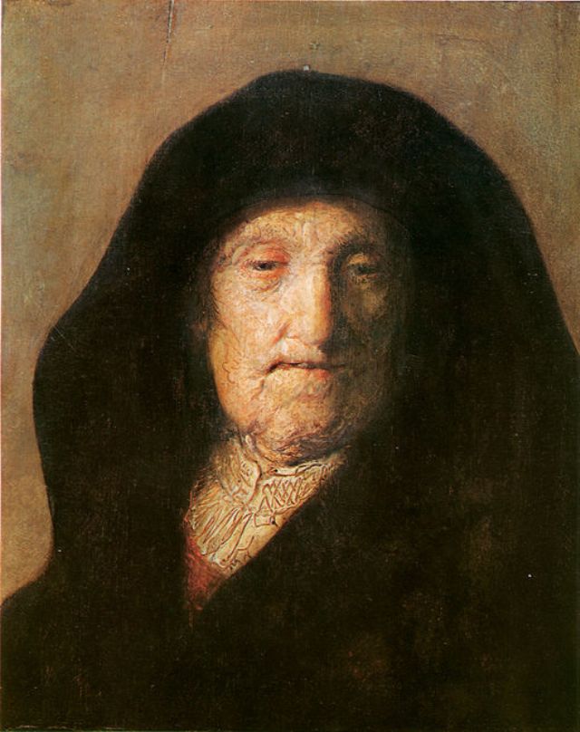 Close head-and-shoulders portrait of an elderly woman in a dark hood, softly lit across the brow and cheek, with a modest patterned collar; Rembrandt’s warm, restrained chiaroscuro emphasizes the texture of aging skin and the quiet mood.