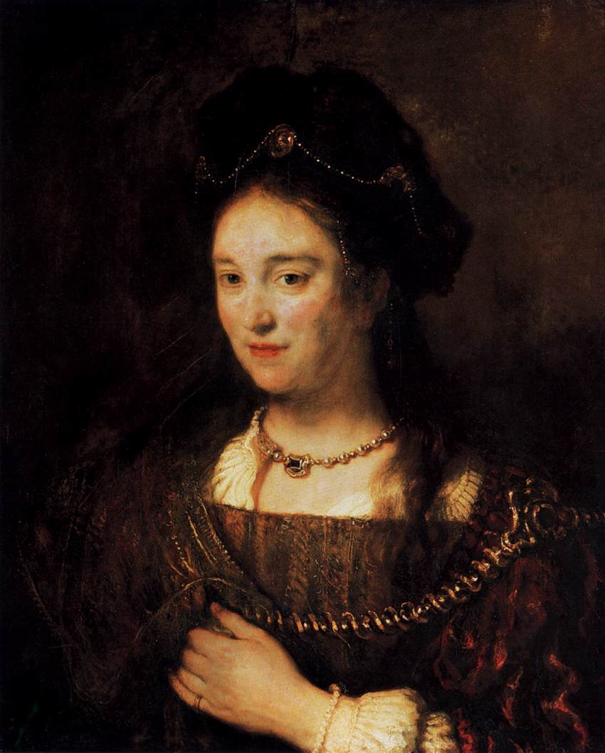 Rembrandt portrait of Saskia facing right, softly lit against a dark background; jeweled headdress, pearl necklace and bracelet, braided gold trim, and a hand drawing her bodice close while her calm gaze and warm complexion glow in subdued light.