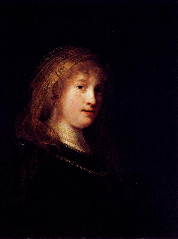 Half-length portrait of Saskia van Uylenburgh turned three-quarters right, softly lit against a dark ground, wearing a delicate gold-trimmed veil and simple chain, painted by Rembrandt in 1634.