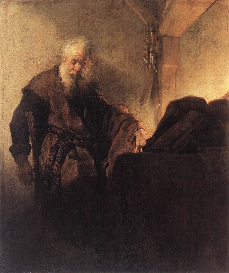 Oil painting of St. Paul seated beside a writing desk in a dim room; warm light from the right falls on his thoughtful face, sleeve, and a stack of manuscripts while a sword and straps hang on the wall and dark robes absorb the surrounding shadow.